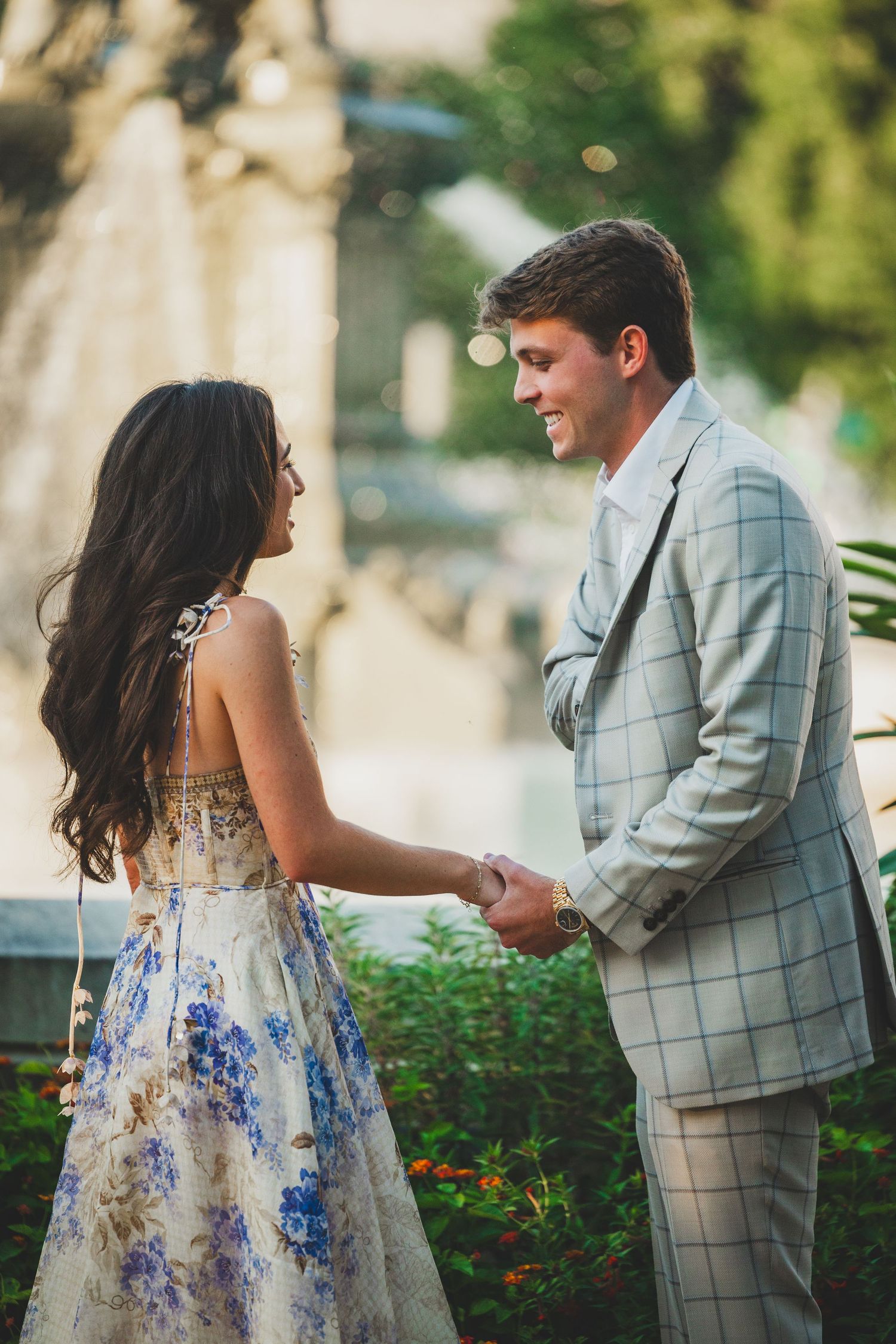 Groom-to-be proposing at sunset in Bartholdi Park
