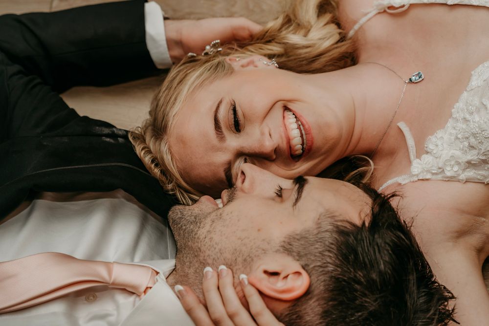 A romantic couple shares intimate moments together in a series of tender black and white photographs.