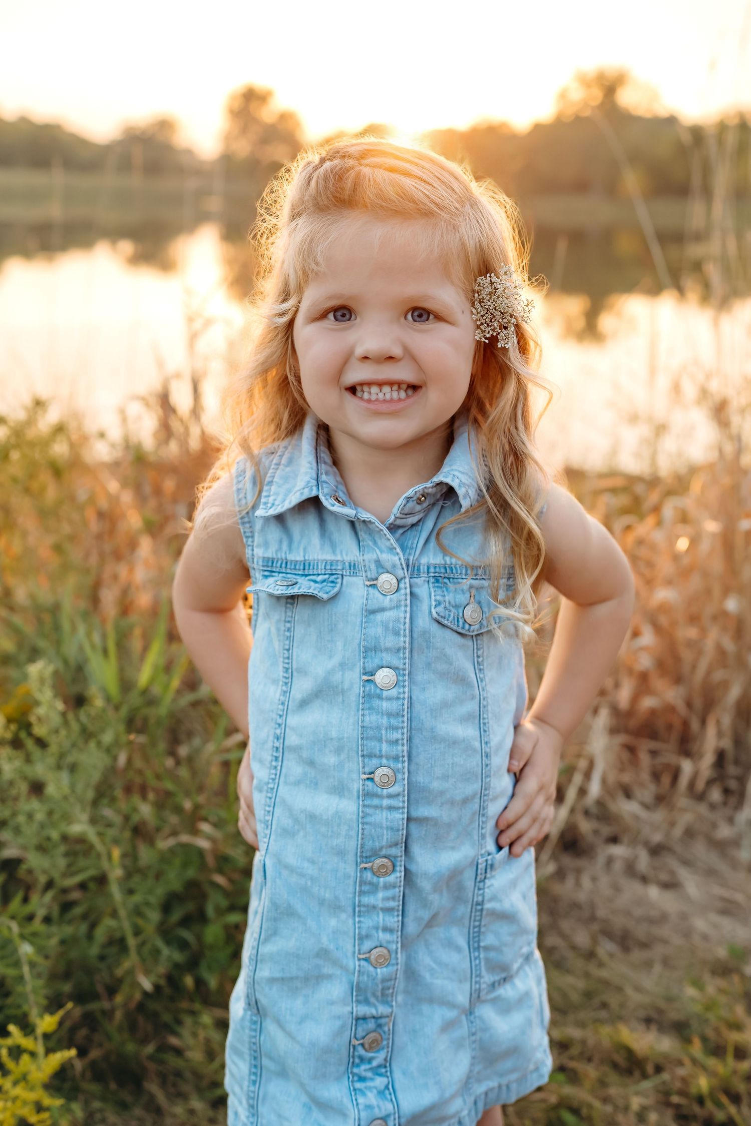 A child in a denim dress plays in a golden field during sunset, captured in a series of candid moments.