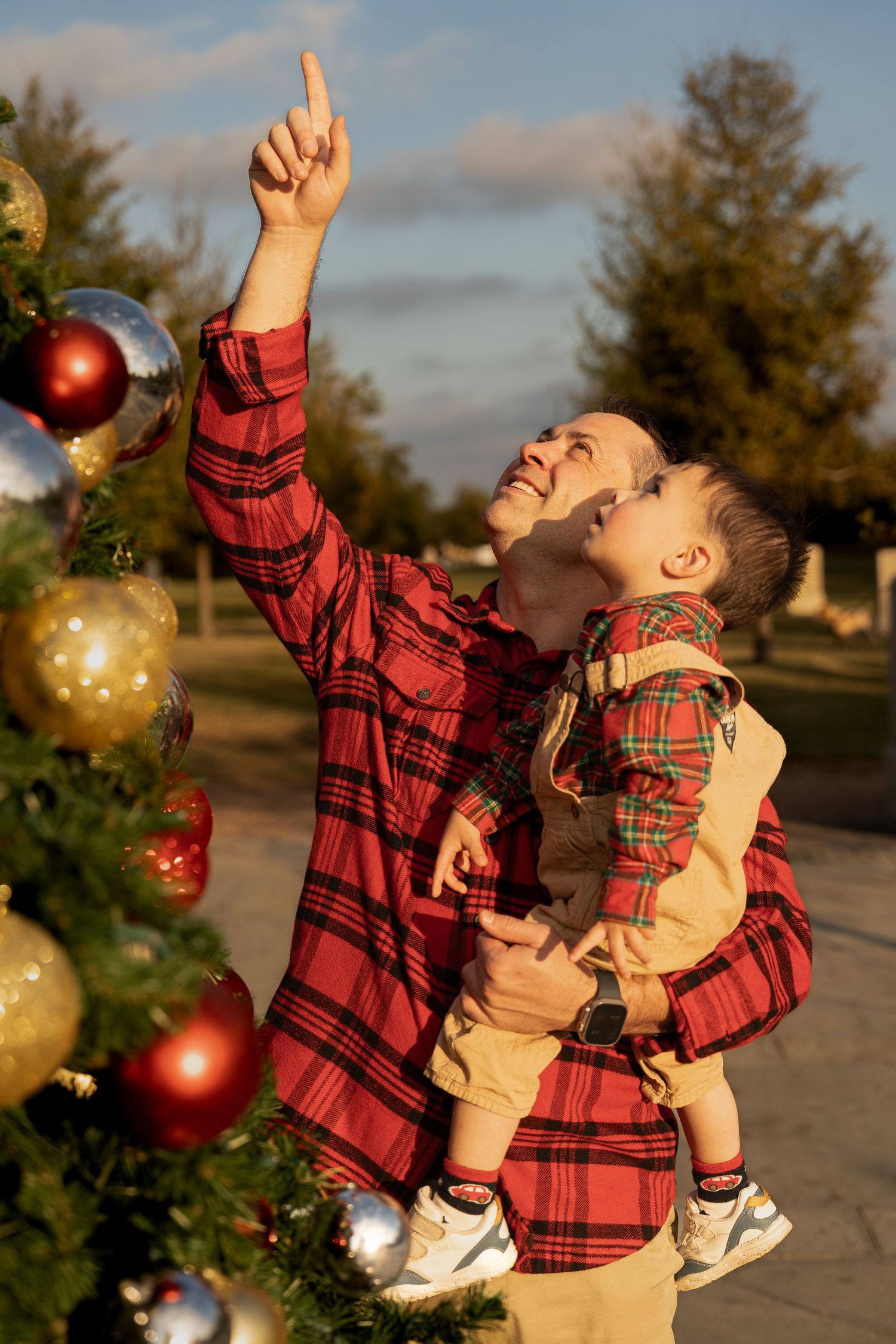 A sequence of joyful moments captured at sunset with red and gold Christmas ornaments in the background.