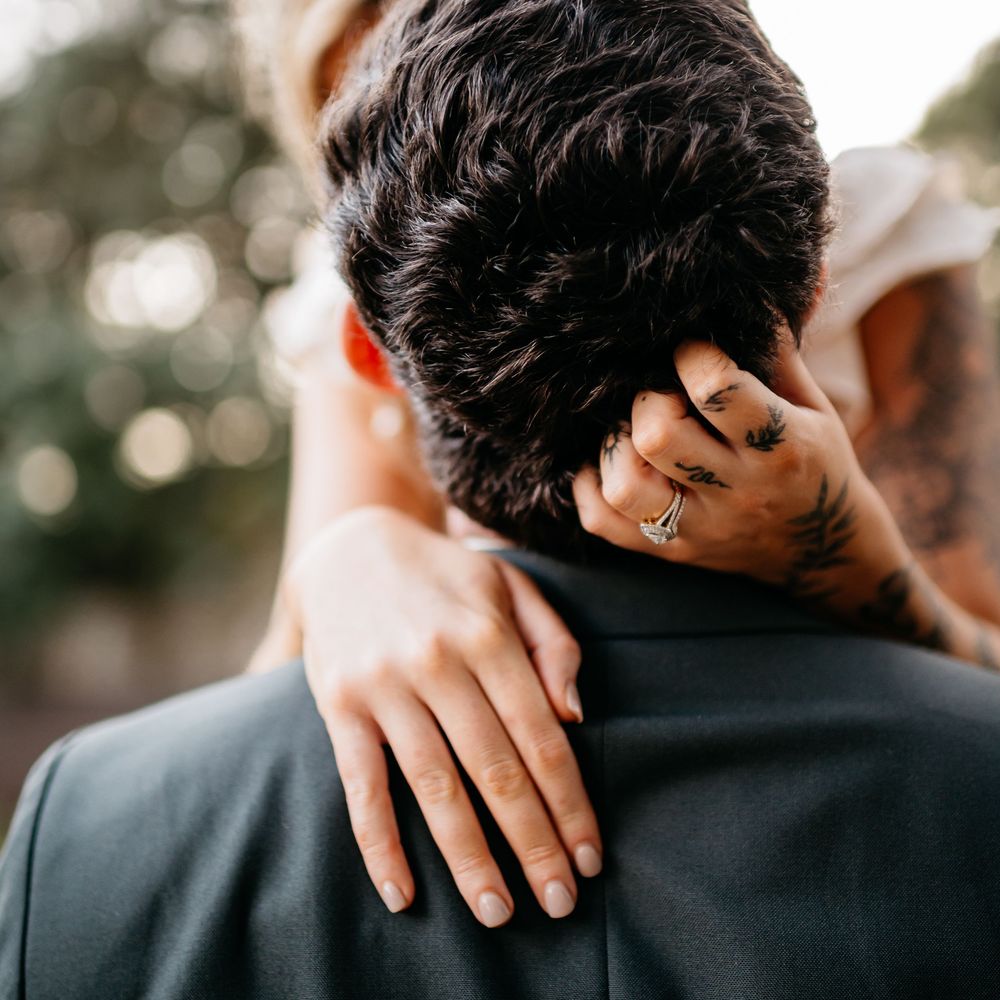 A close-up series of hands embracing shoulders in formal attire during what appears to be a favorite wedding moment in Fort Walton Beach FL