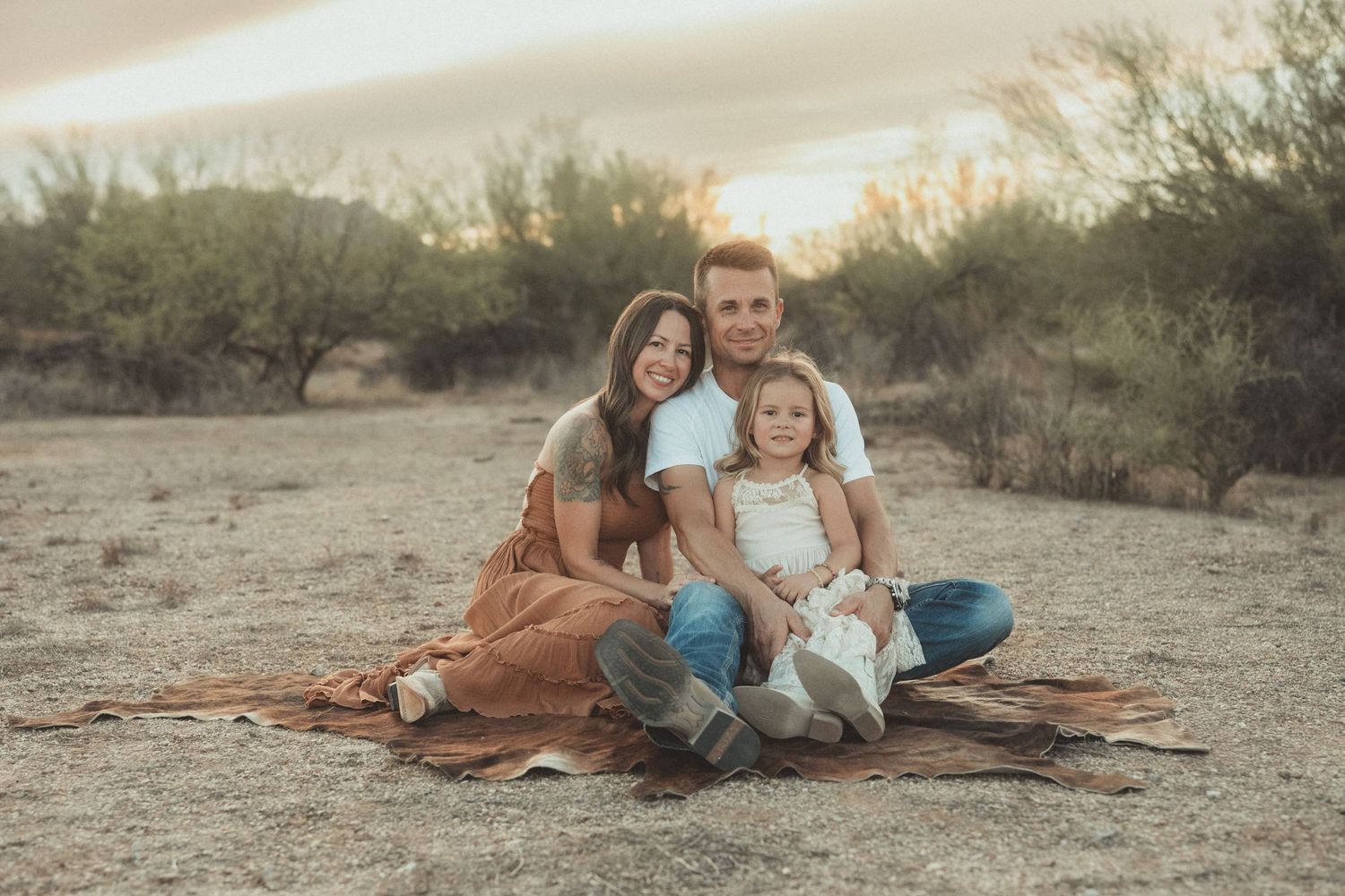 A series of intimate family portraits showing tender moments between parents and child against a soft natural background.