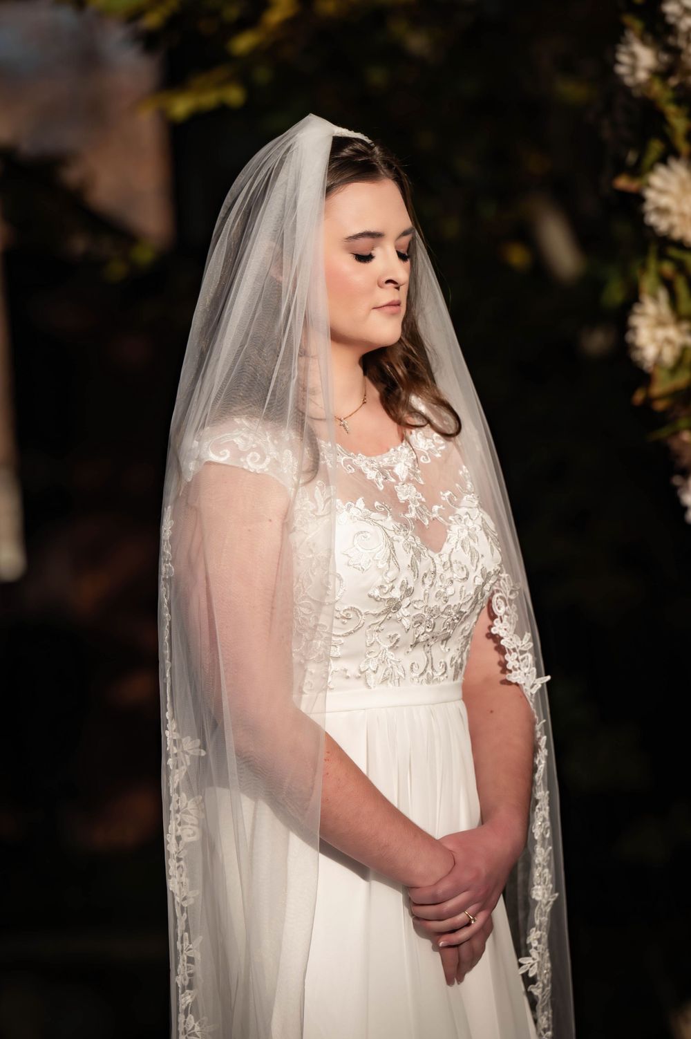 A dreamy photo of a bride during the wedding ceremony at the Roberts Mansion in Spokane Washington.