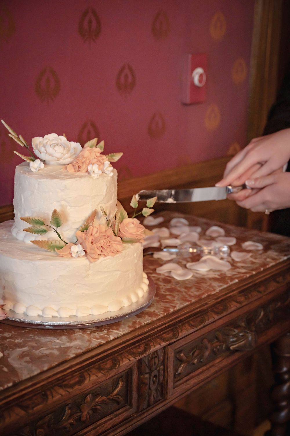 A photograph of a cake cutting at the Roberts Mansion in Spokane Washington.