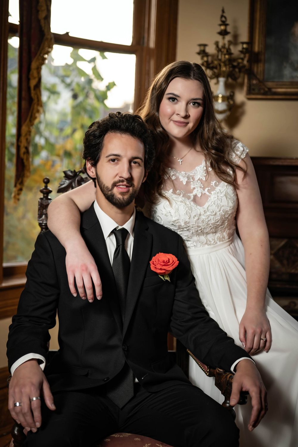 A dreamy photo of a bride and groom sitting in a chair at the Roberts Mansion in Spokane Washington.