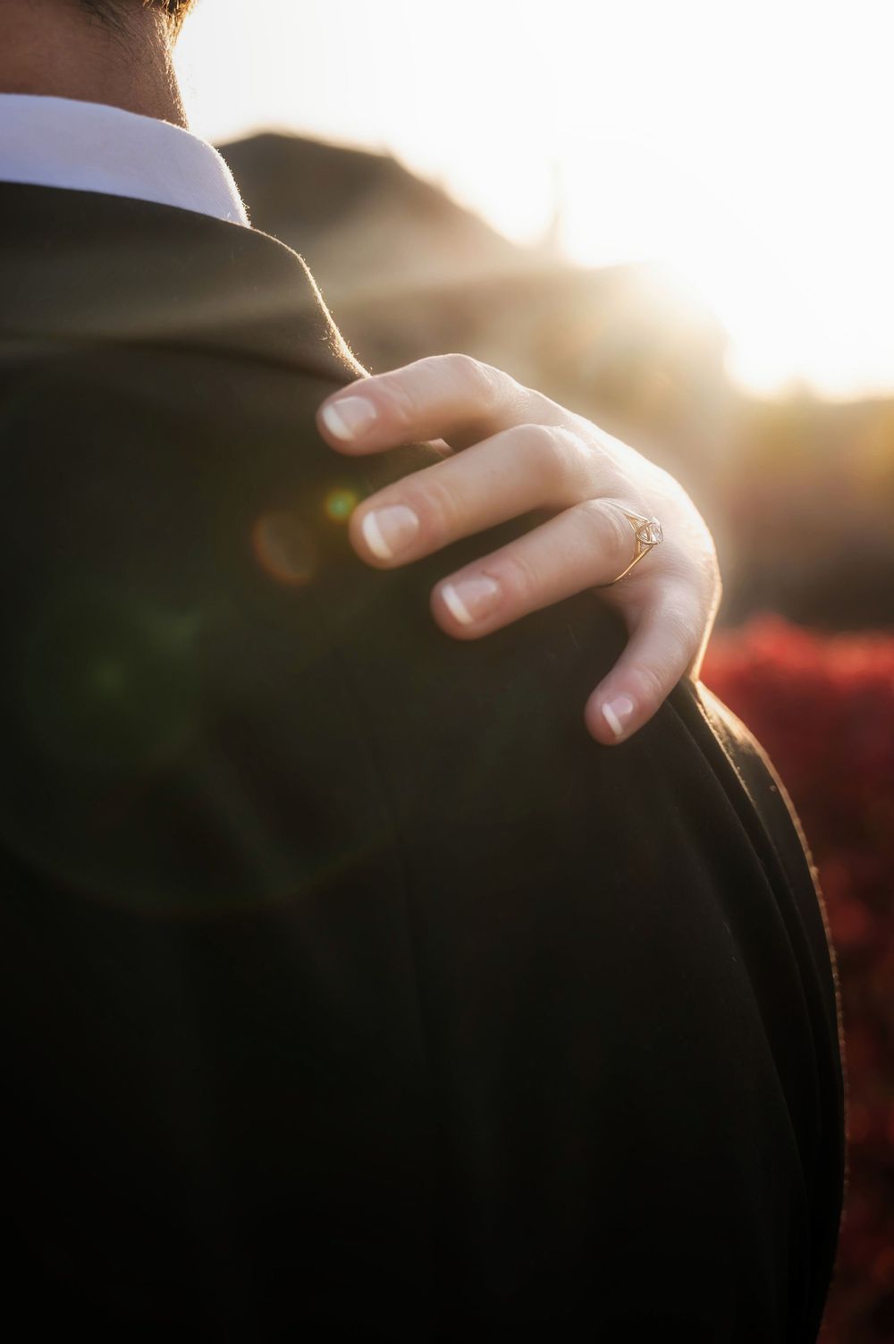 Golden hour dreamy glow of a brides ring hand outside at the Roberts Mansion in Spokane Washington.