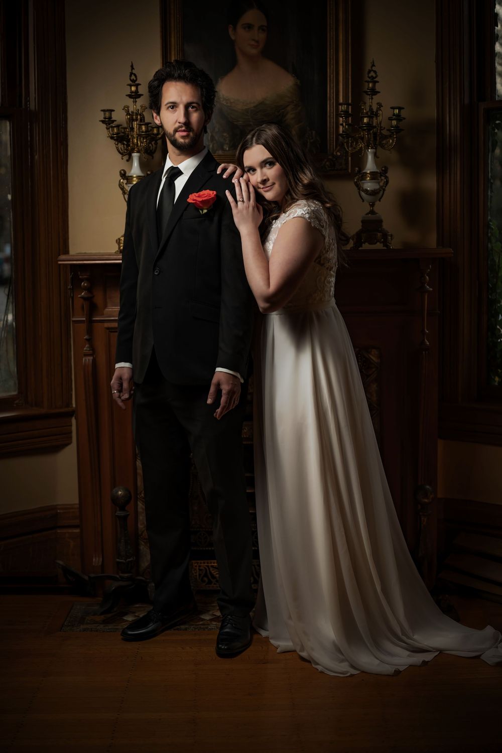 An ethereal dreamy portrait of a bride and groom standing in front of a fire place at the Roberts Mansion in Spokane Washington.