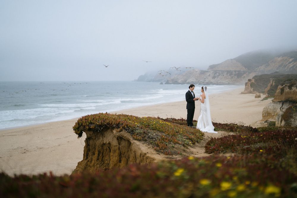 Panoramic view of a misty coastal cliff landscape with dramatic ocean views.