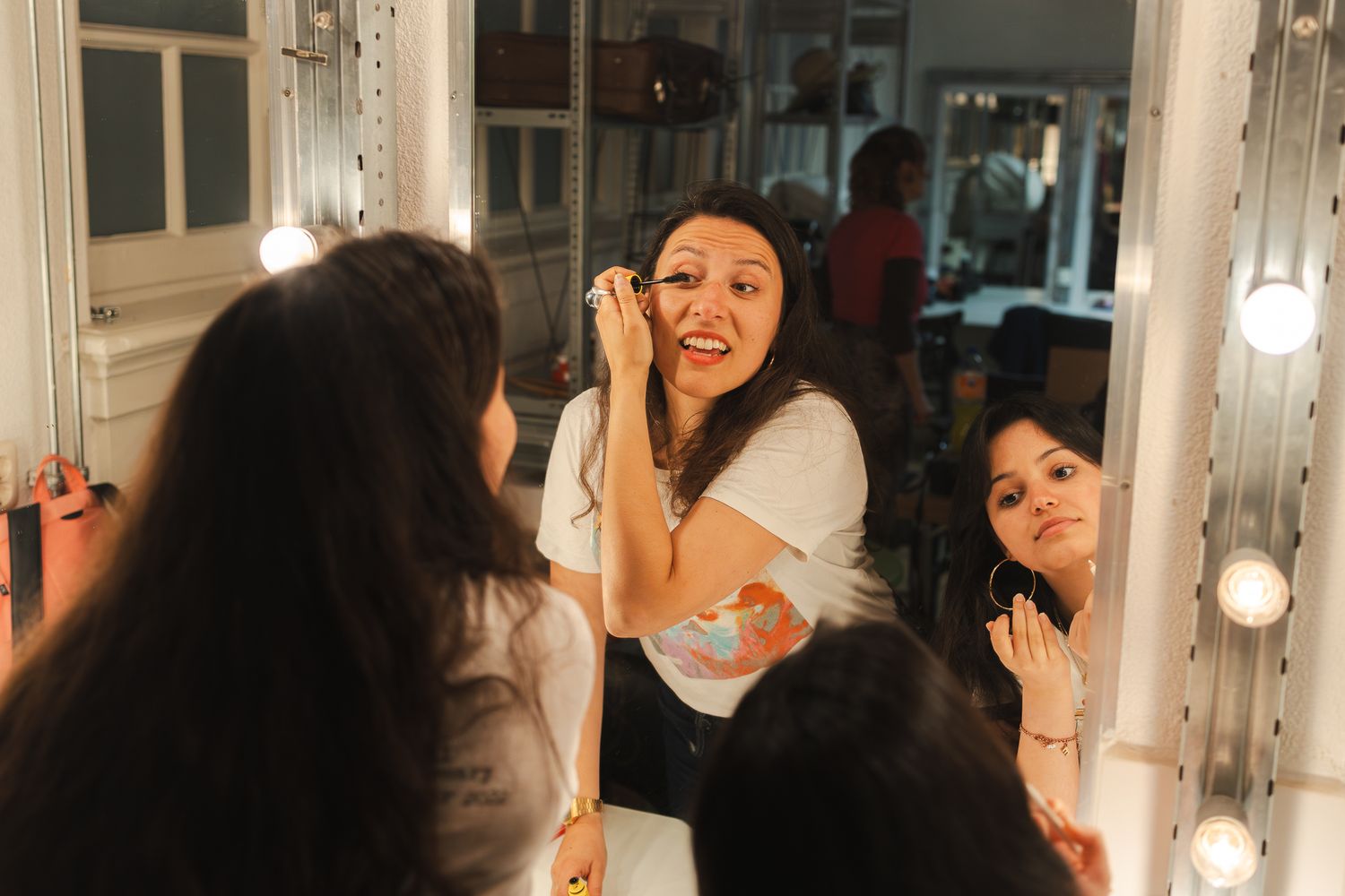 A group of friends celebrating at a party with sparklers and festive decorations.