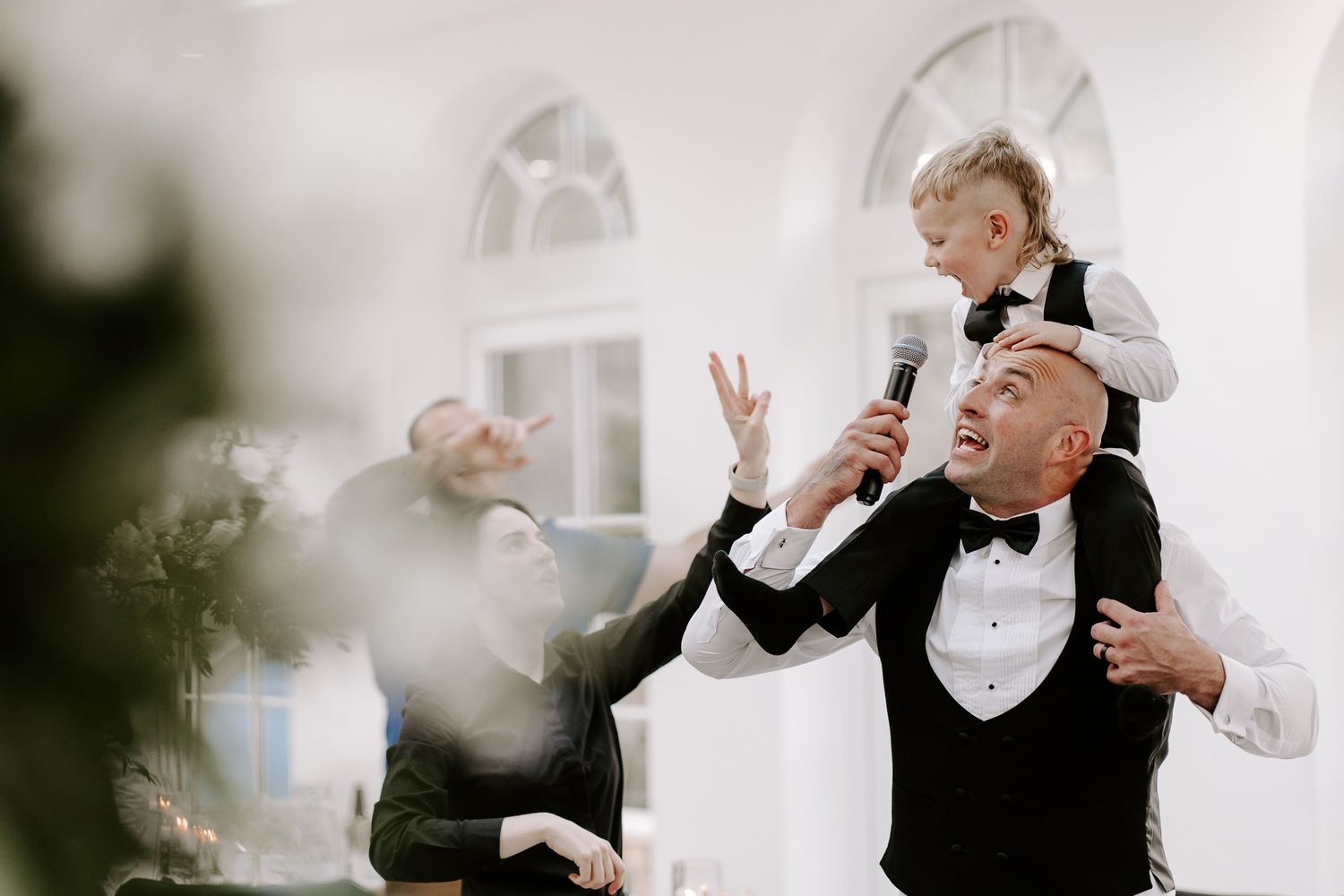 A sequence of wedding moments showing a couple sharing laughter and champagne during their outdoor celebration.