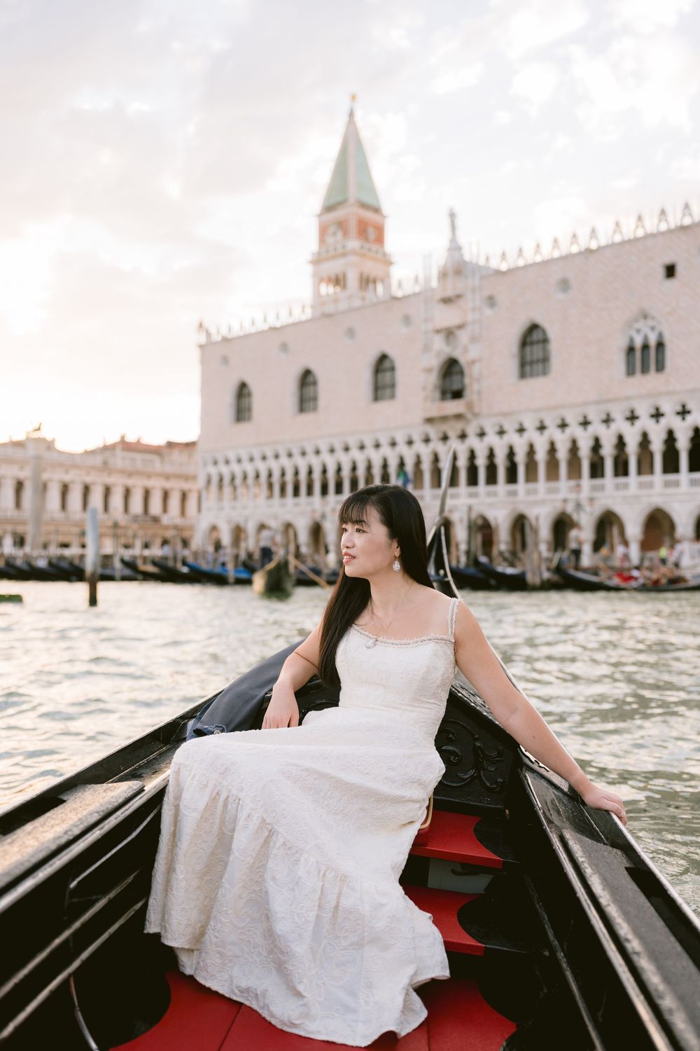 A gondola ride through Venice's canals. Book your Venice photoshoot with Alina Indi, a Venice and wedding photographer