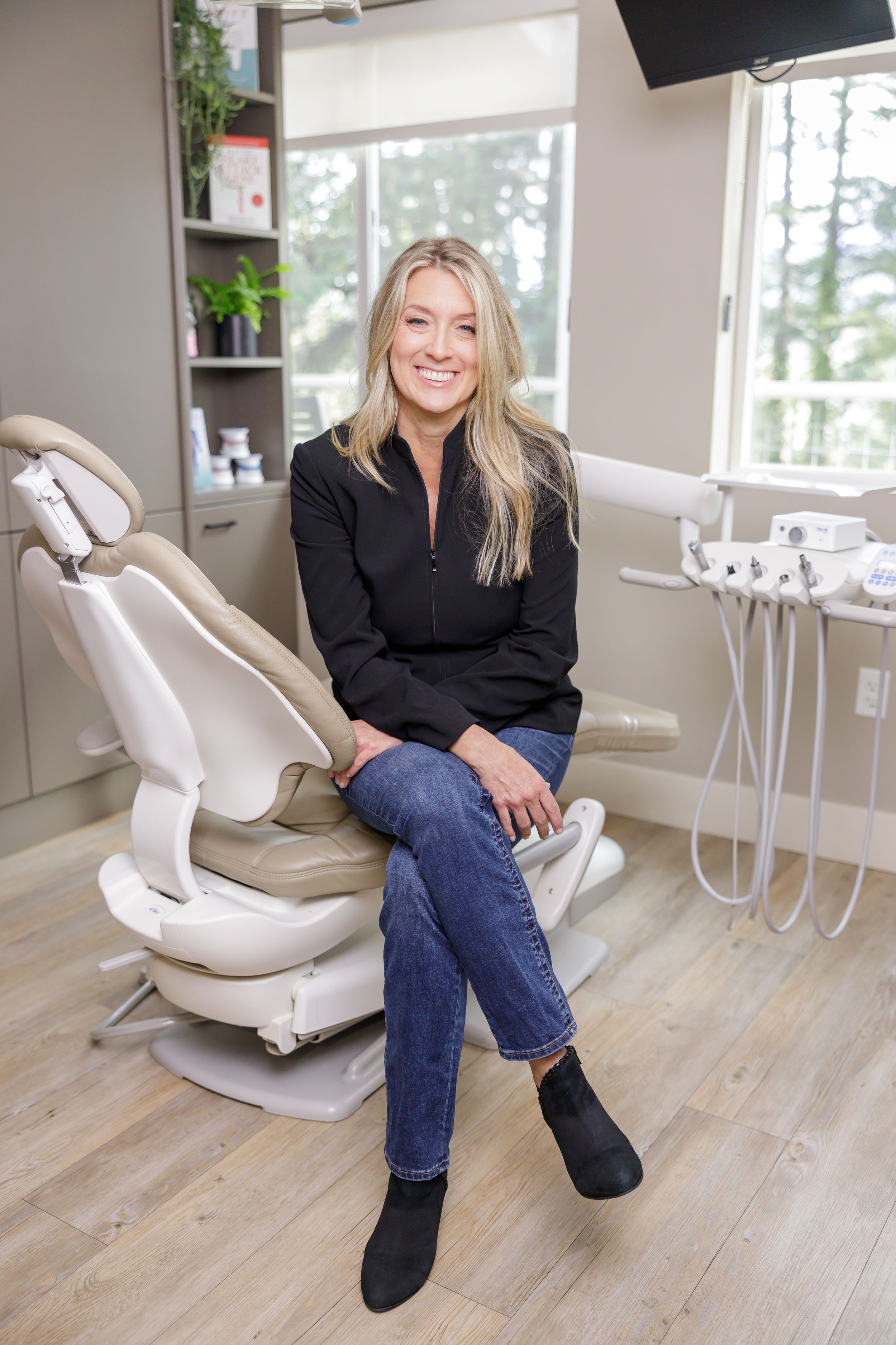 woman dental hygienist sitting in dental chair lifestyle office headshot on Orcas Island, WA