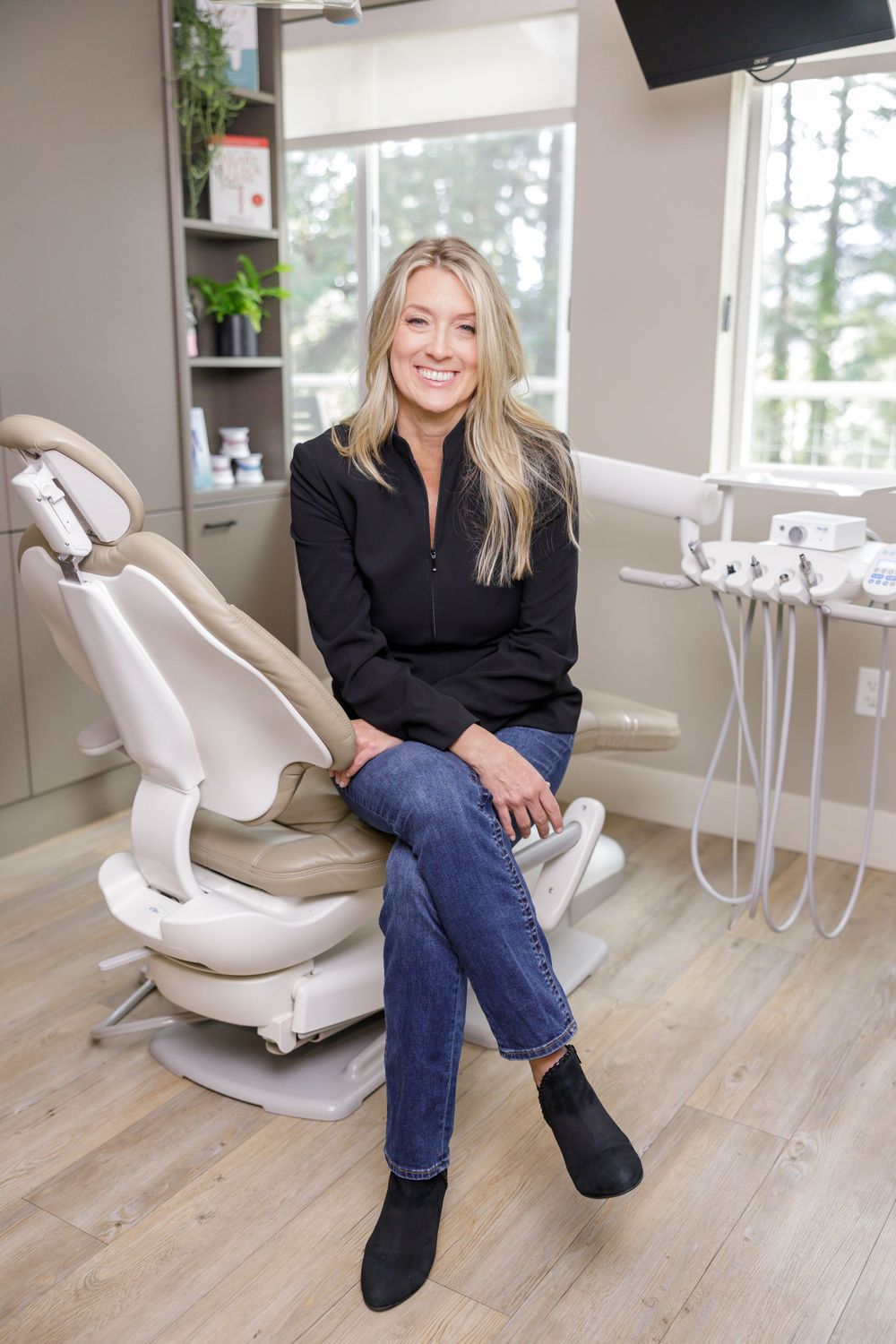 woman dental hygienist sitting in dental chair lifestyle office headshot on Orcas Island, WA
