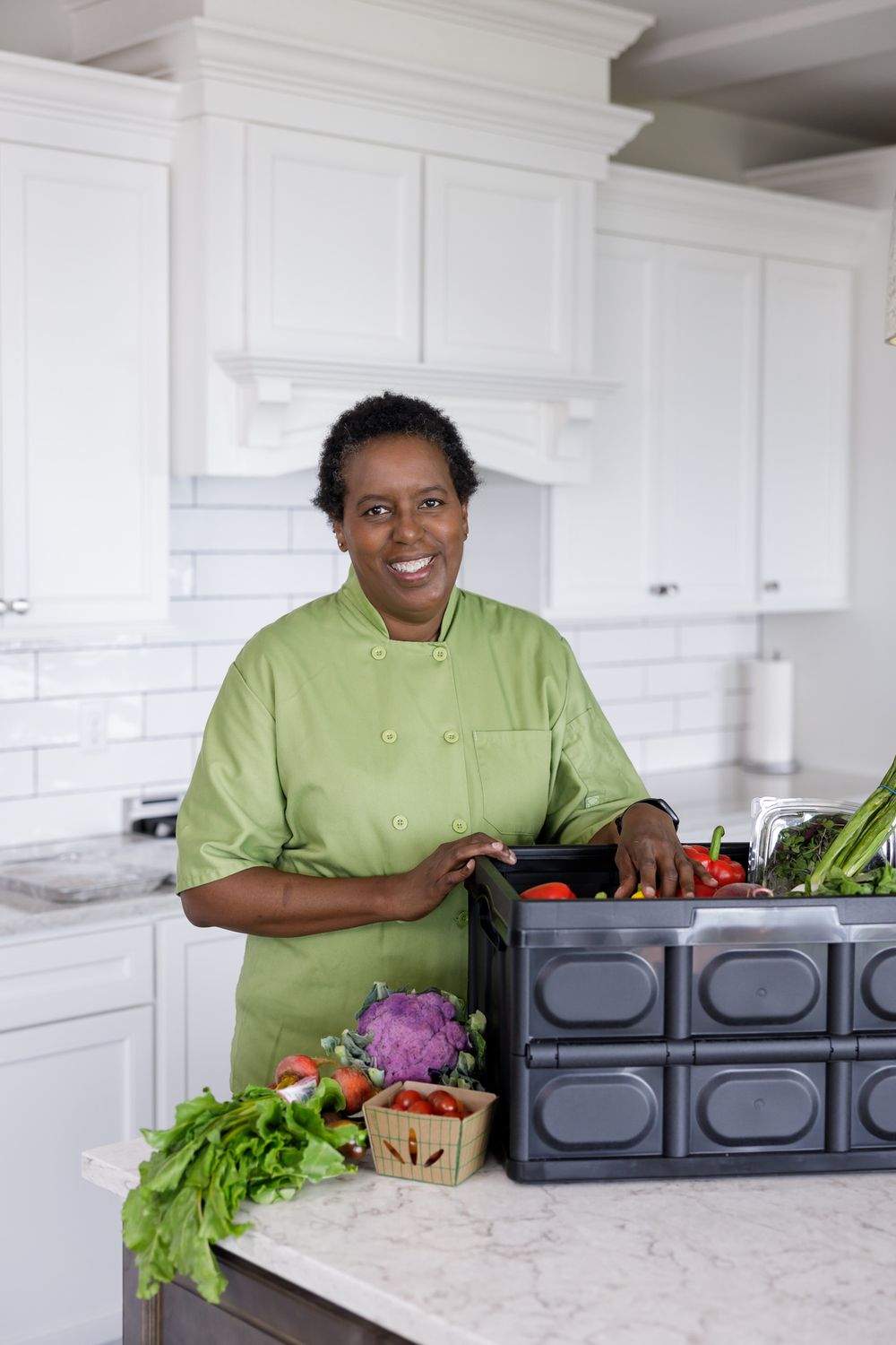 female black woman of color personal chef standing in kitchen unpacking food for lifestyle branding photo in Seattle, WA