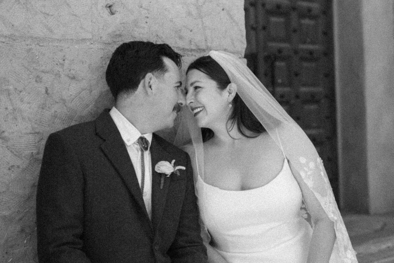 Santa Barbara film photographer captures an intimate moment on film at the Courthouse between bride and groom.