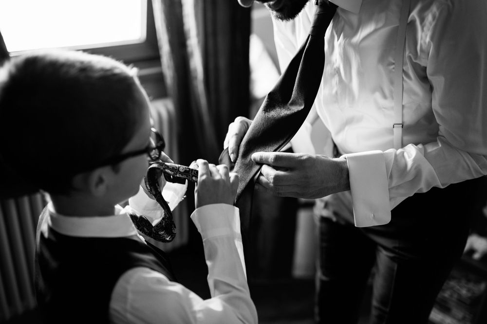Black and white photo of a couple dancing intimately at their wedding reception.