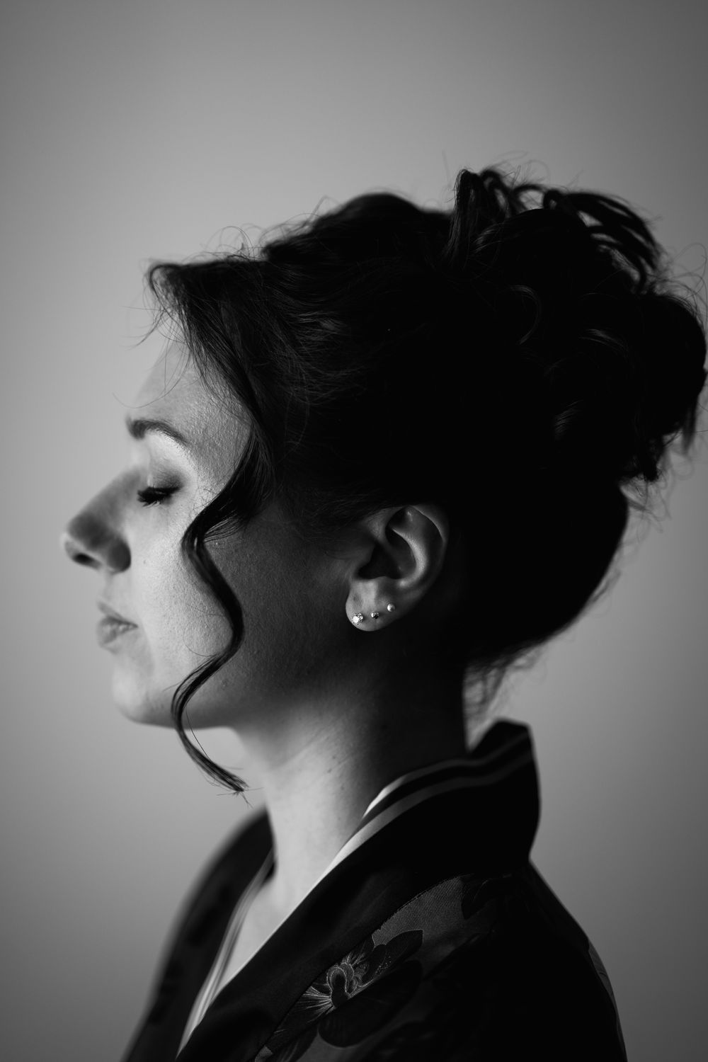 Artistic black and white profile silhouettes showing dramatic angles and lighting.