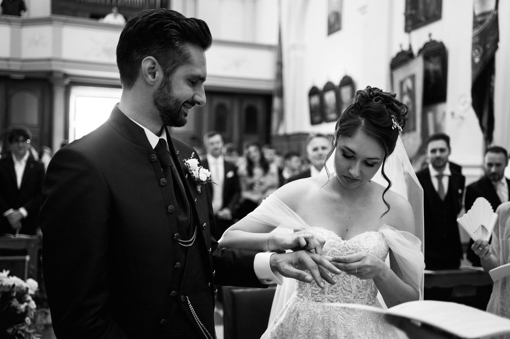 Elegant black and white wedding photography montage showing intimate moments between newlyweds during their special day.