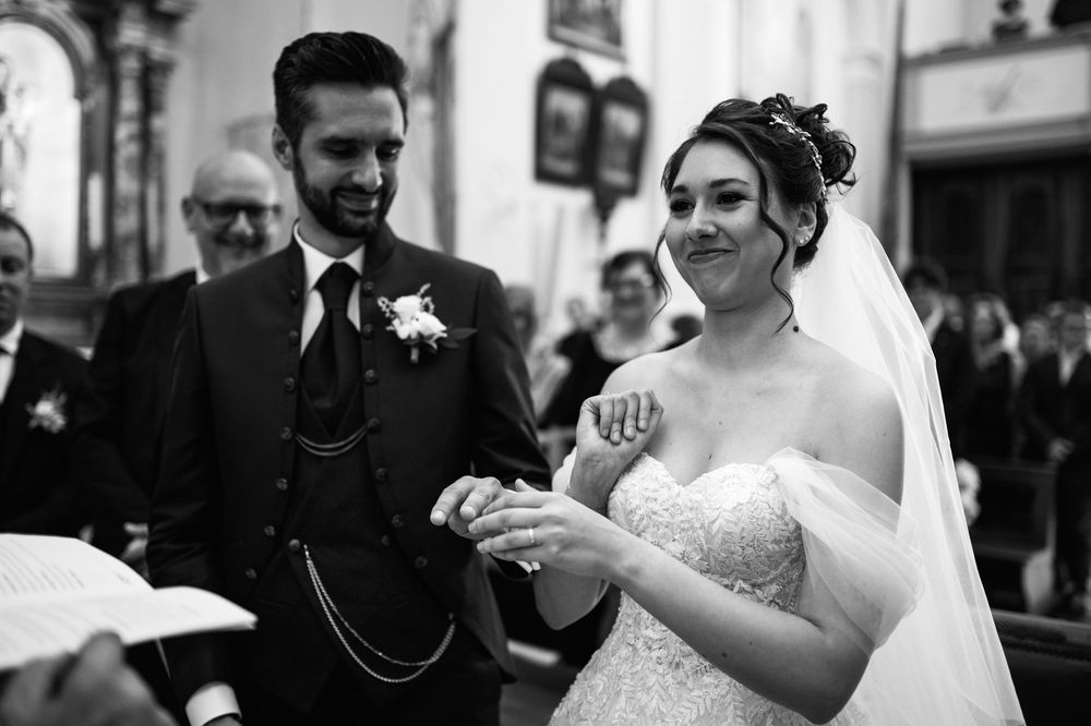 Wedding celebration in a rustic indoor venue with stone walls and festive atmosphere.
