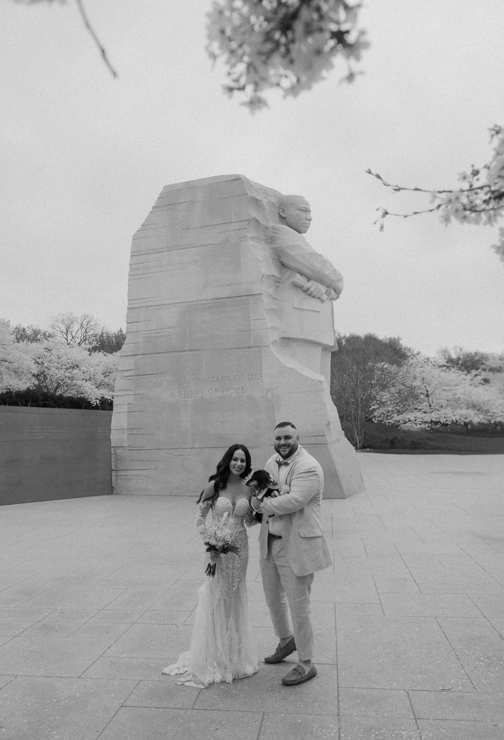 Black and white photo series showing a couple at the Martin Luther King Jr Memorial in Washington DC.