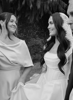A series of black and white photos showing a bride in an elegant off-shoulder wedding gown.