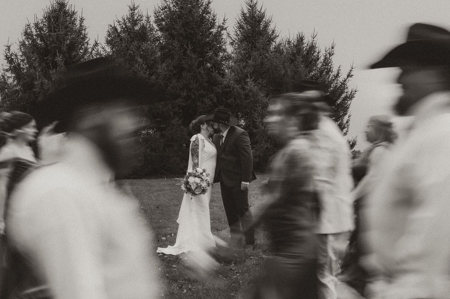 Indiana Wedding and Elopement Photographer // A wedding party moves in a blurred motion across an outdoor setting.