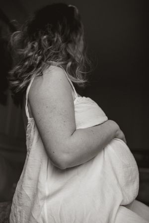 A series of black and white photographs showing someone in a white shirt turning their head away from the camera.