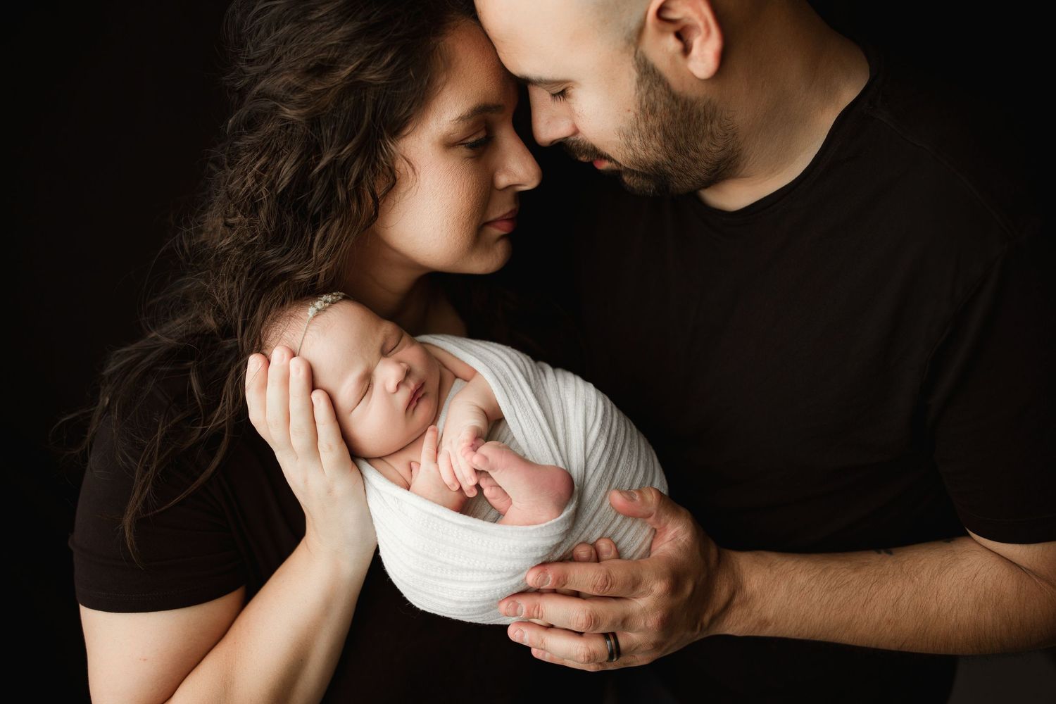 newborn parent posing
