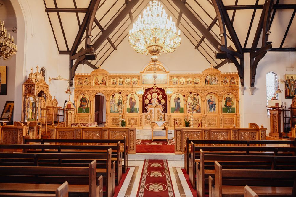 The intricate beauty of a Melbourne church, with its rich colors and ornate details, provides a stunning backdrop for the baptism ceremony.