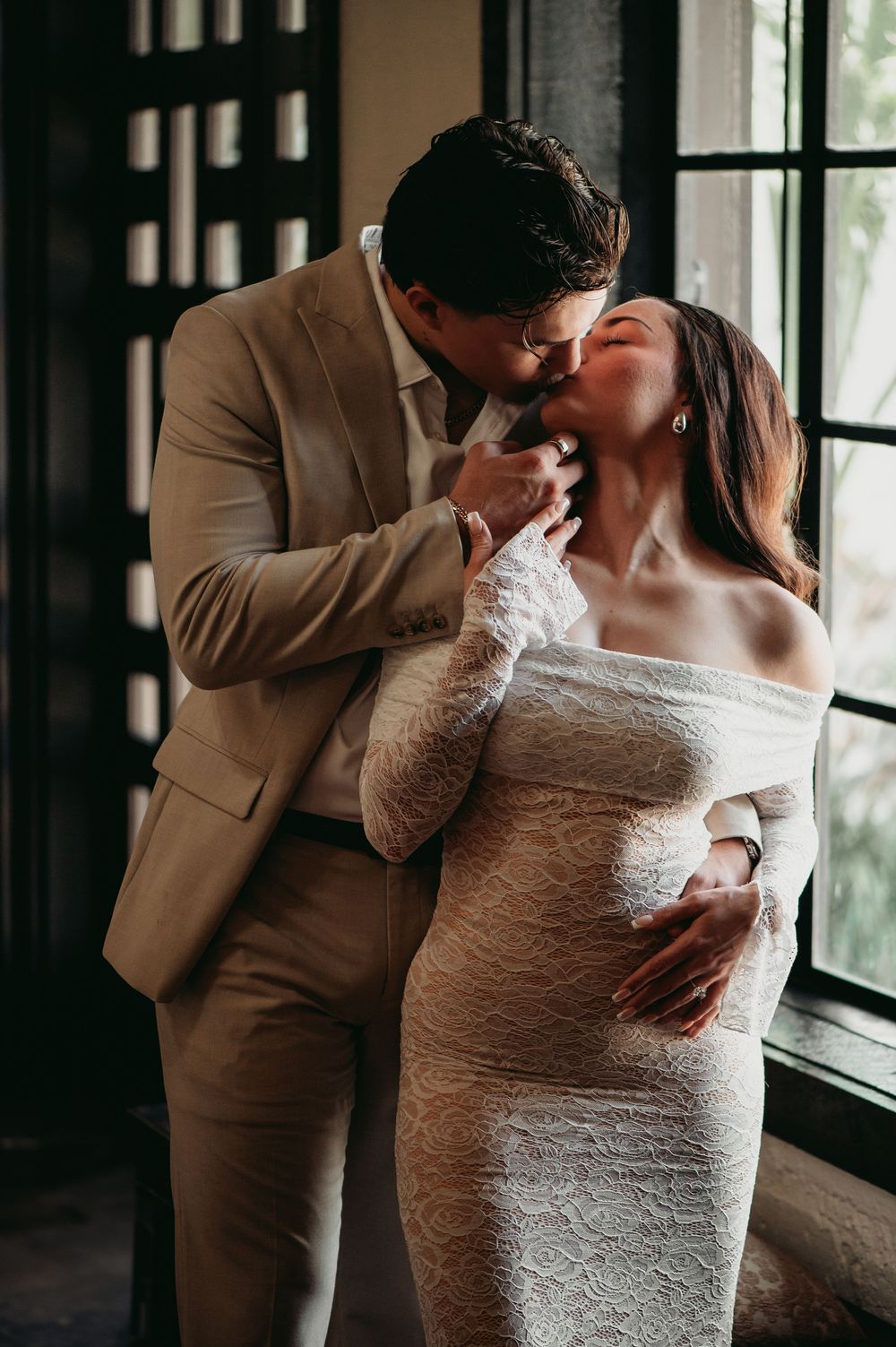 Intimate wedding photography sequence showing tender moments between newlyweds near a window.