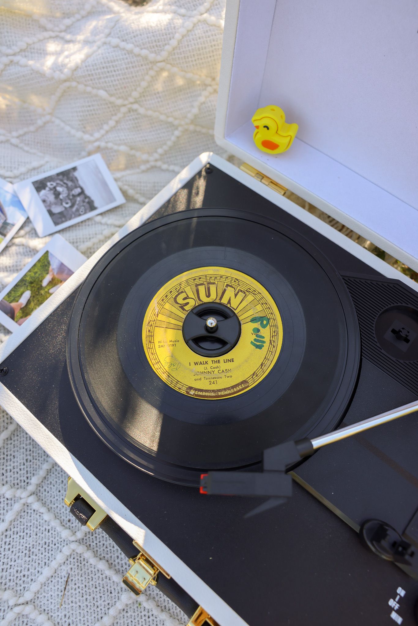 Vintage vinyl records on display with Sun Records label visible.