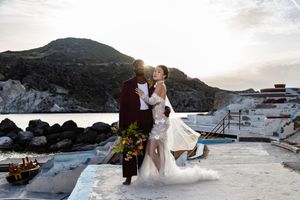 A snowy winter wedding photoshoot featuring a couple posing against dramatic mountain landscapes and glaciers.