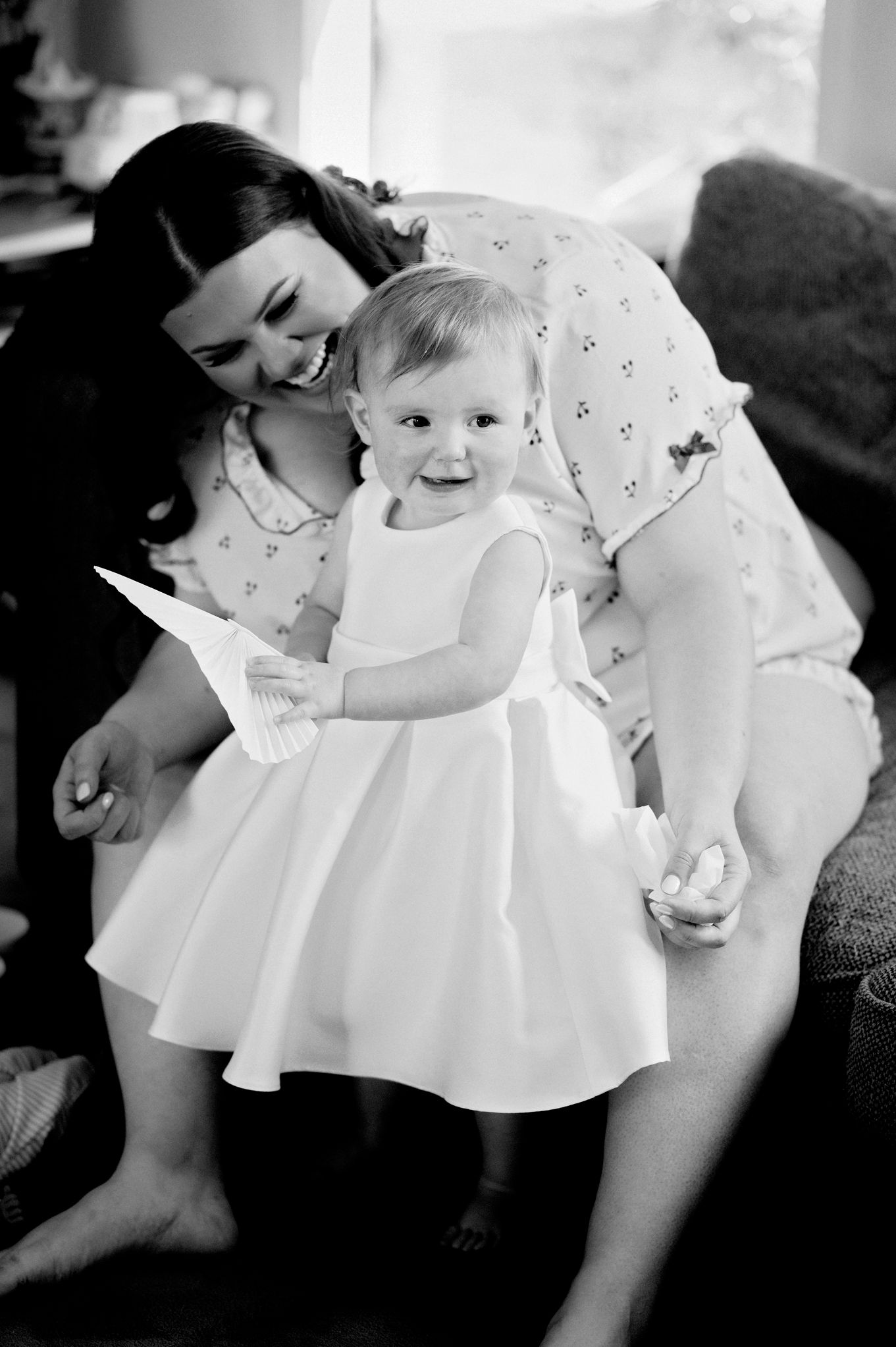 Black and white photographs showing tender moments during an intimate celebration.
