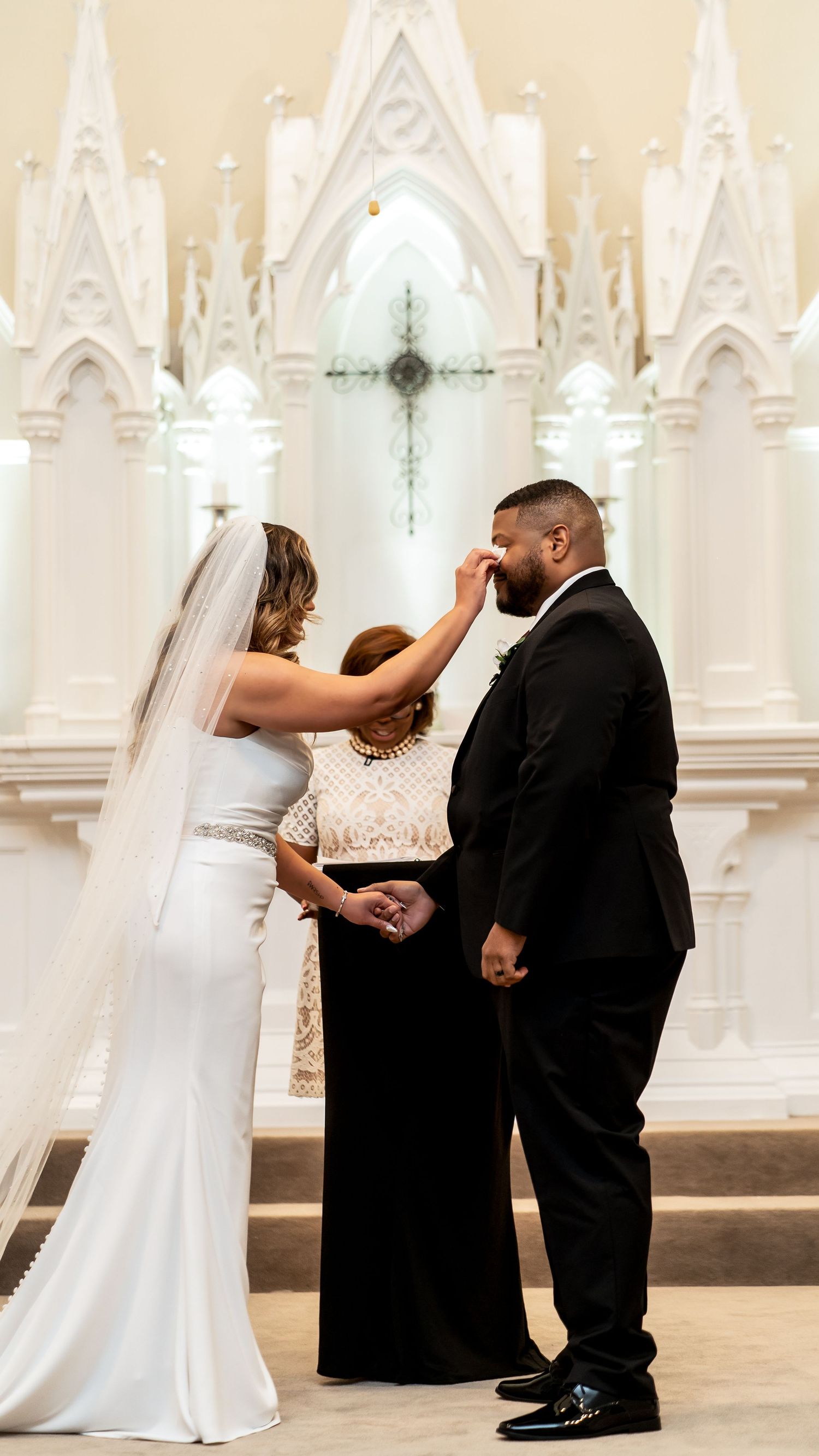 A sequence of wedding ceremony moments captured in a beautiful white church with gothic architectural details.