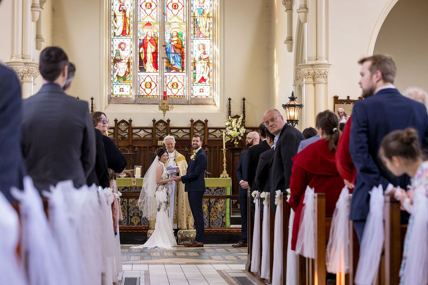 Bride and Groom share a moment during their wedding cermeony at St. Matthews Church in Albury. Photo by Jason Robins