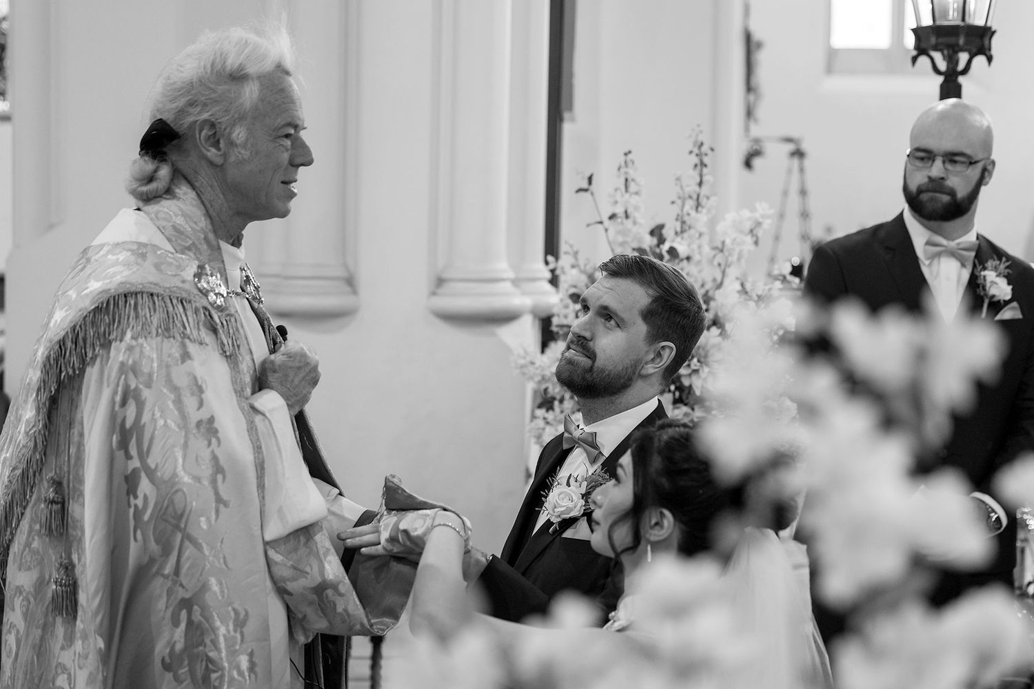 Bride and Groom share a moment during their wedding cermeony at St. Matthews Church in Albury. Photo by Jason Robins