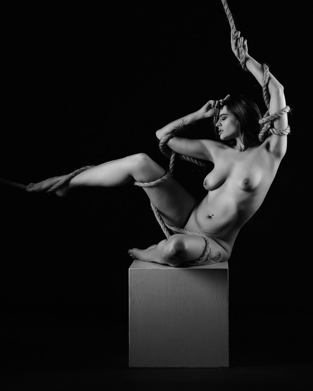 David G Holt Photography - Black and white artistic nude figure posed gracefully on geometric platform.