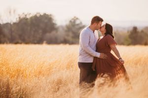 Pregnant mom in a flowing dress during an outdoor maternity session in North Georgia.