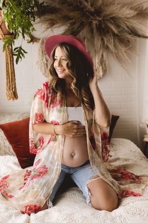 Playful maternity session in the Urso Photography Studio photographed with natural light.