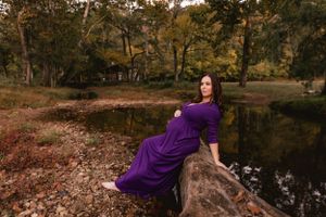 Maternity photo taken in the woods, capturing the beauty of pregnancy amidst the natural scenery near Chattanooga, by Urso Photography.