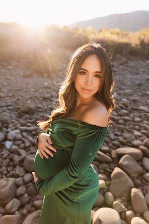 Golden hour maternity session in a Chattanooga field, captured by Urso Photography.