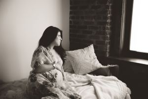 Maternity photo in Urso Photography’s studio, celebrating the journey to motherhood with a soft, intimate vibe.