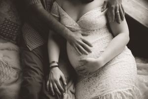 Intimate maternity photo session in studio with Urso Photography, celebrating new beginnings.