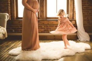 Pregnancy portrait session in Urso Photography’s studio, capturing the special moments of maternity with a personal touch.