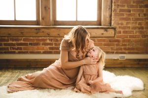 Maternity portrait with Urso Photography, capturing the connection between mom and baby.