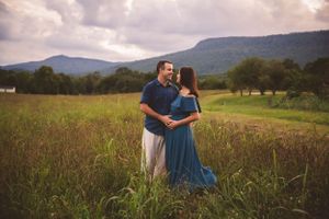 Maternity photo in the mountains captured by Urso Photography, celebrating the journey to motherhood in a beautiful natural setting.