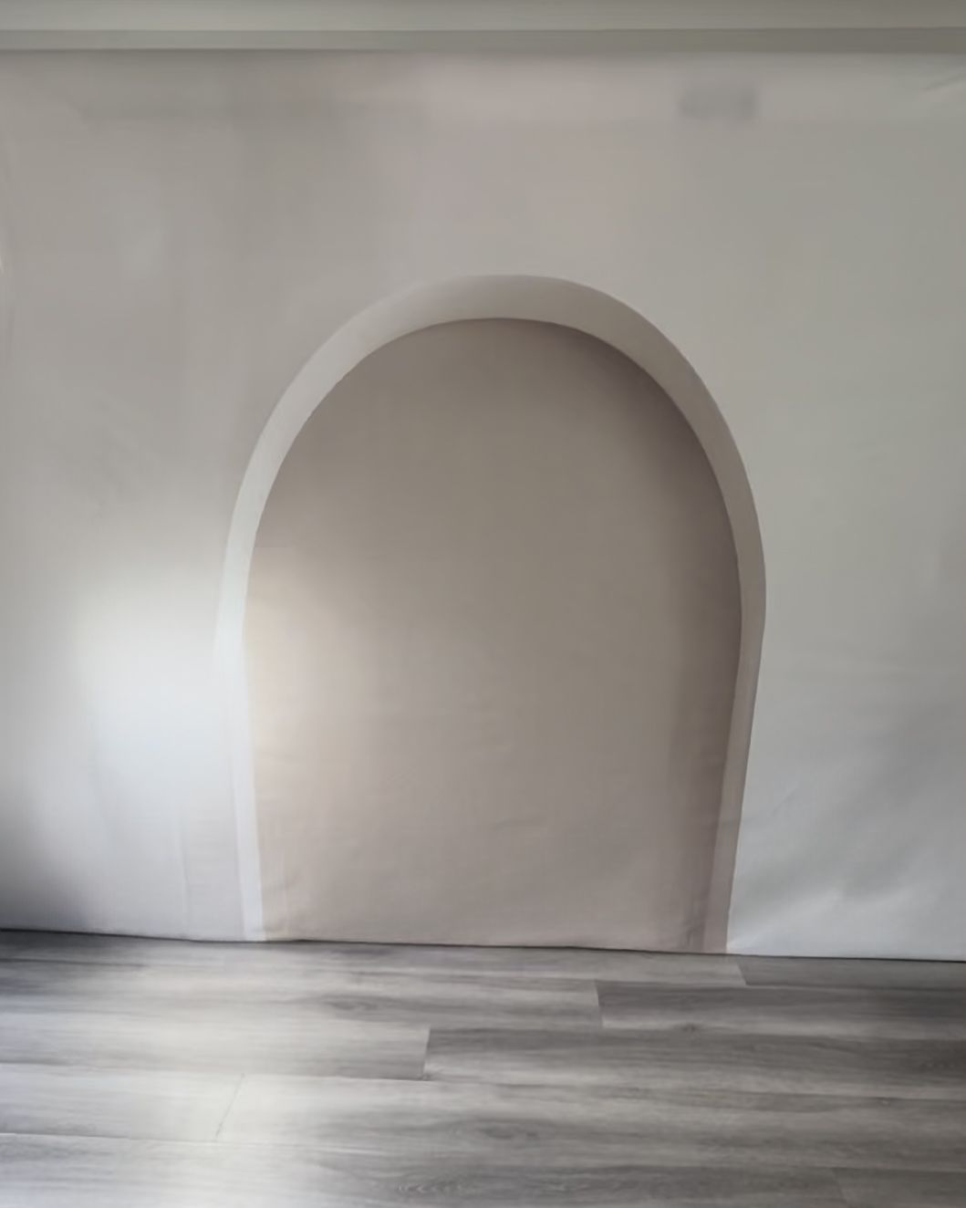 Minimalistic, white arch fabric photography backdrop.