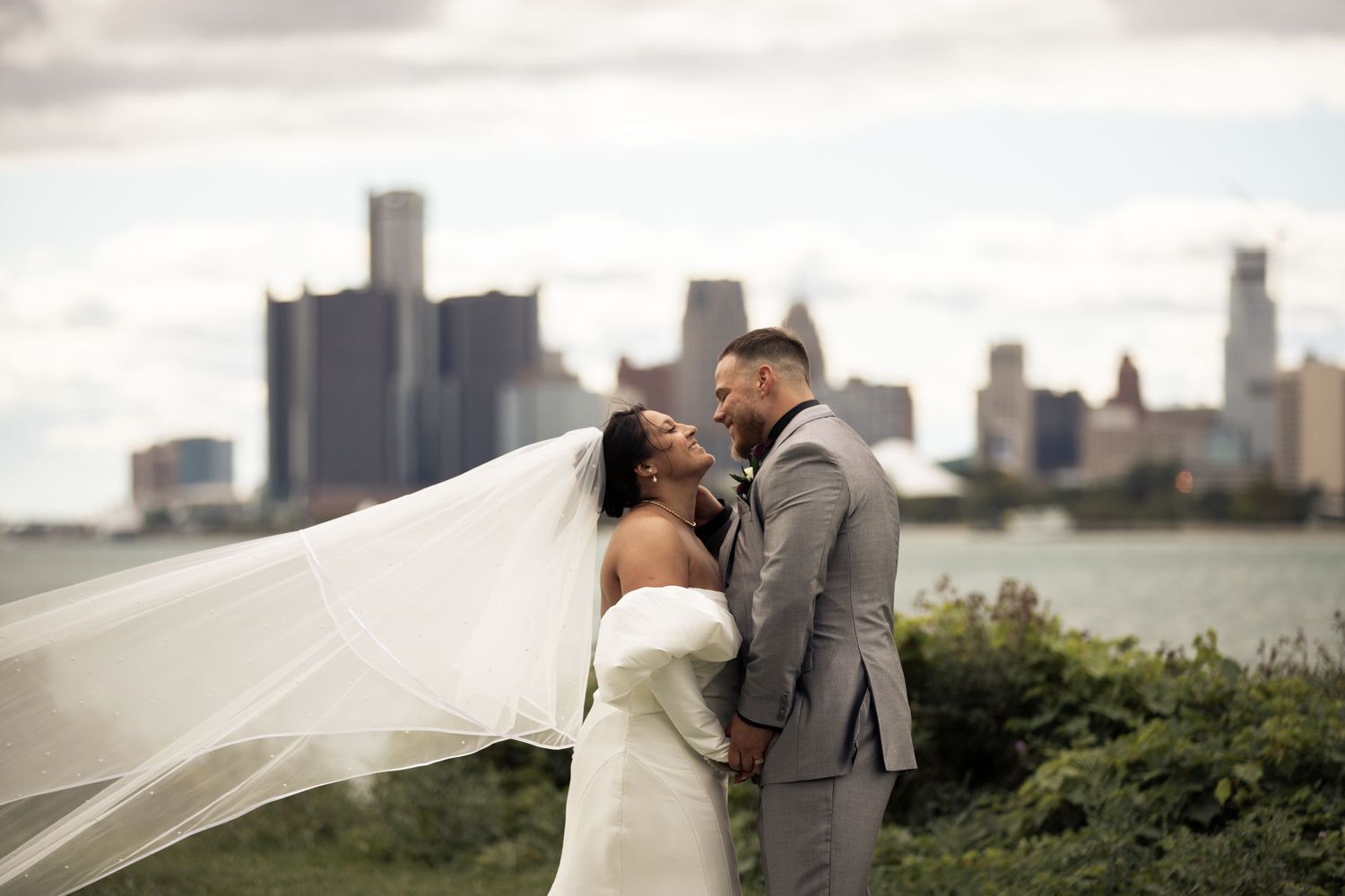 A wedding portrait of a couple In front of down town Detroit Michigan.