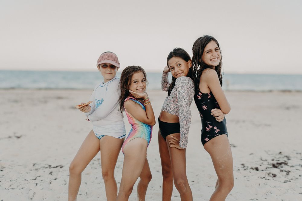 Group enjoying a fun beach day together photoshoot in Puerto Morelos.