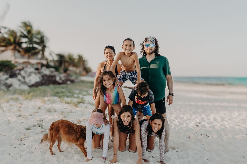 Friends gathered together for beach photos with their dog photoshoot in Puerto Morelos.